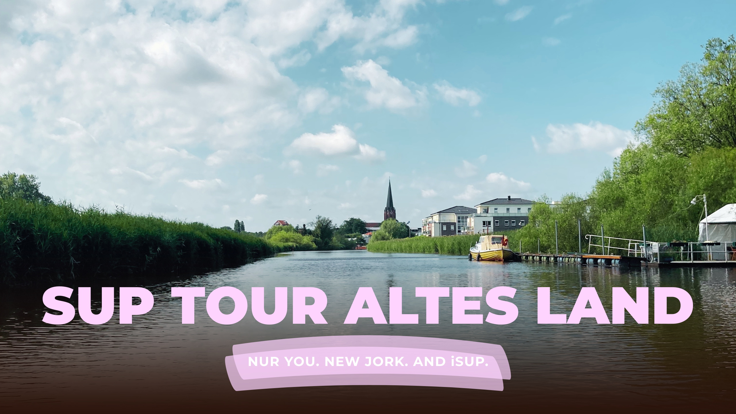 sup tour altes land with view from the water facing the church of buxtehude